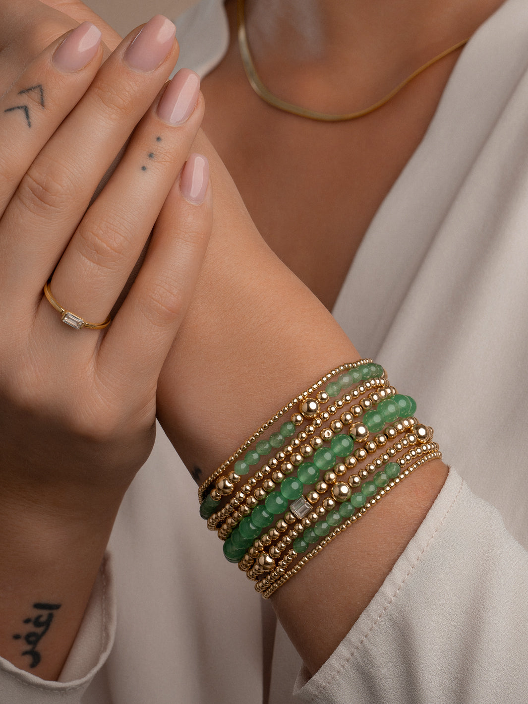 Sparkling armbanden in goudkleur met groene aventurijn edelsteen