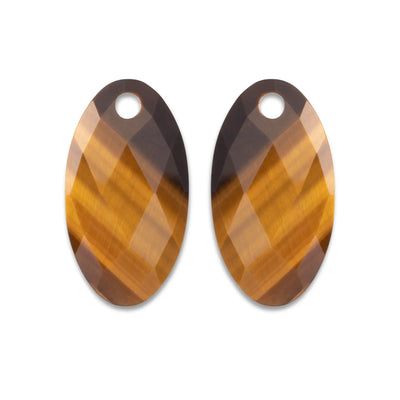 Twee ovaalvormige, gefacetteerde kristallen hangers met een gradiënt van amber- en donkergroene tinten.