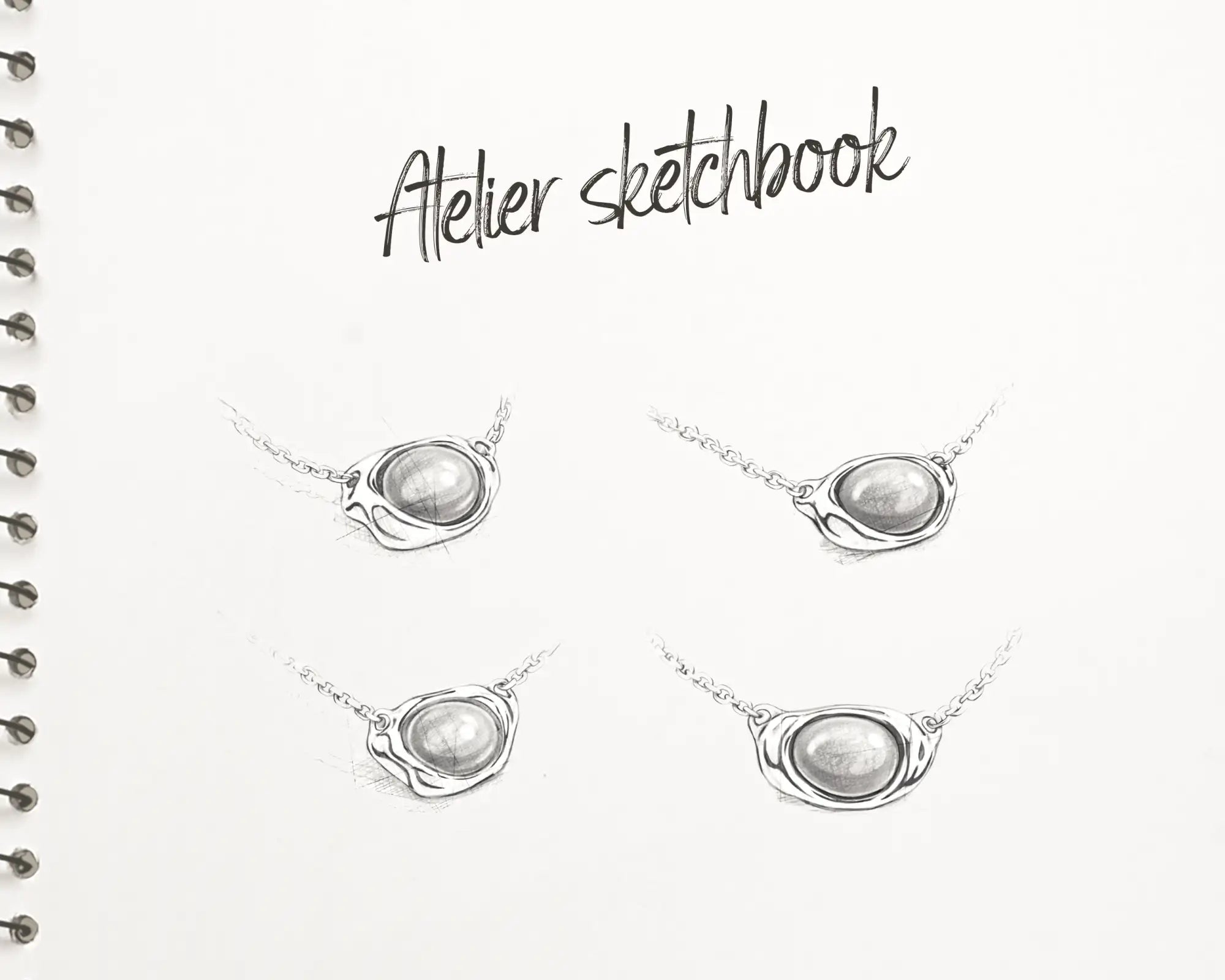 Zilveren hangerkettingen met ovale, gladde stenen centra en delicate schakels.