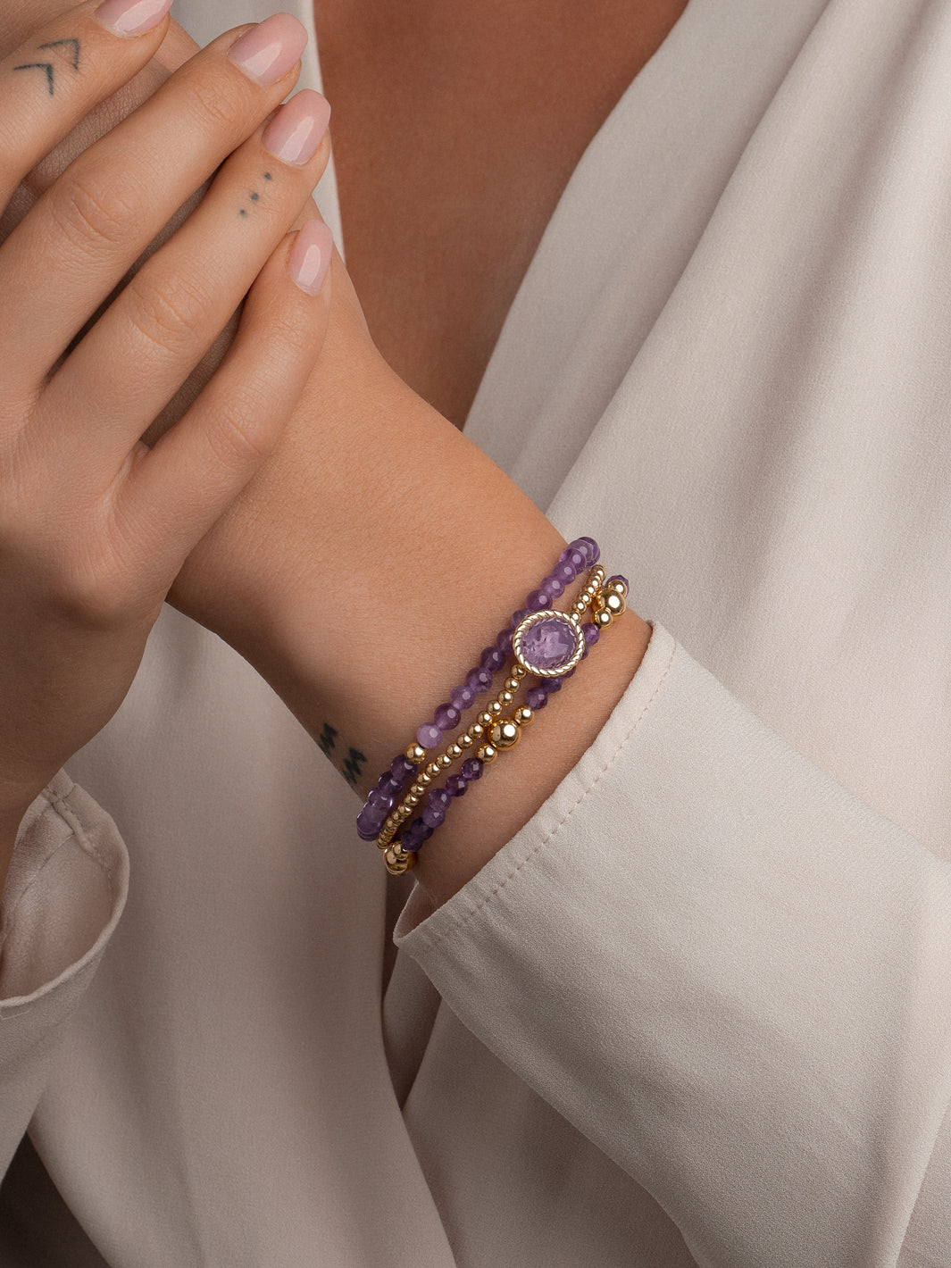 Prachtige gouden armband met een amethyst edelsteen 